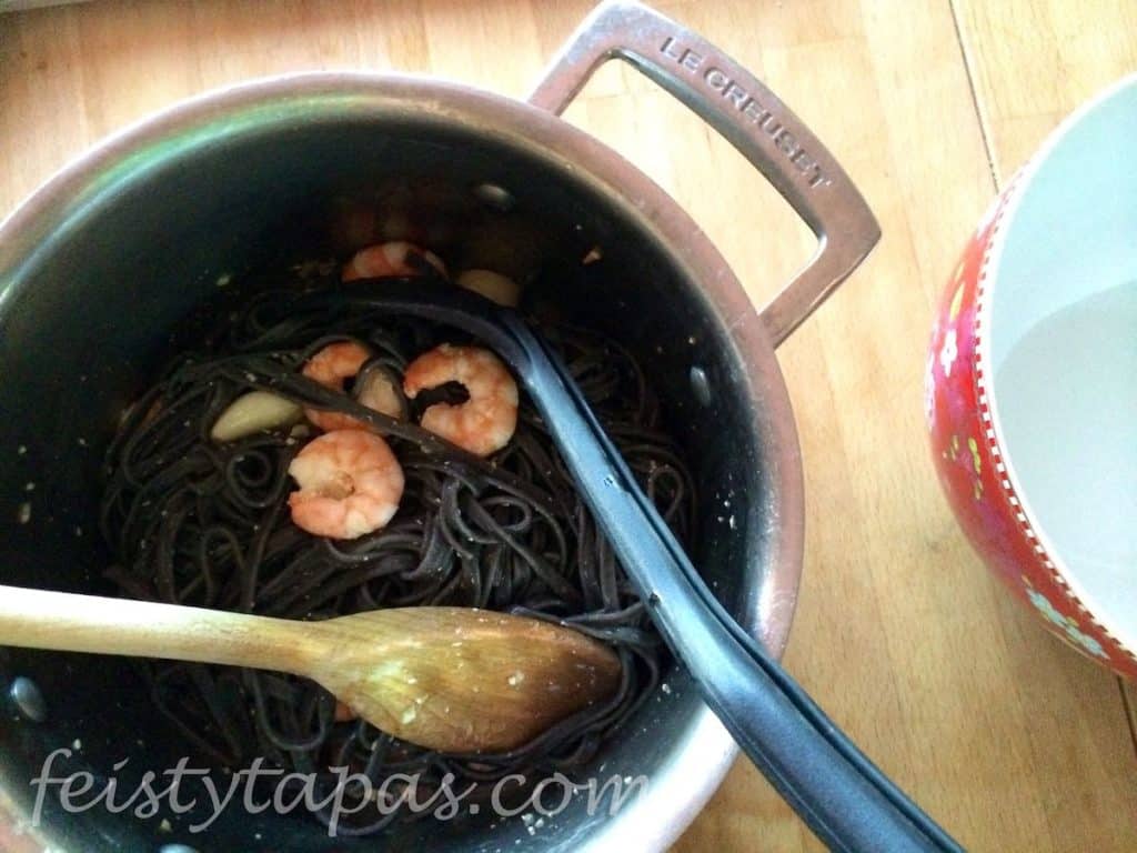 Squid Ink Pasta with Prawns all mixed in the pan