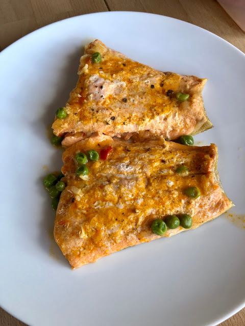 Instant Pot Prawn, Trout and Pea Risotto. Trout fillets on a white plate. A Feisty Tapas recipe. Pressure cooker risotto with arborio rice, peas, prawns, trout Instant Pot Prawn, Trout and Pea Risotto