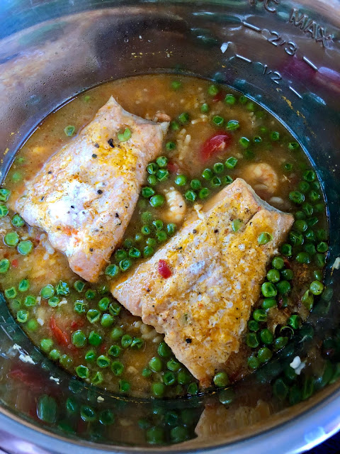 Instant Pot Prawn, Trout and Pea Risotto in the inner pot. Freshly cooked. A Feisty Tapas recipe. Pressure cooker risotto with arborio rice, peas, prawns, trout Instant Pot Prawn, Trout and Pea Risotto