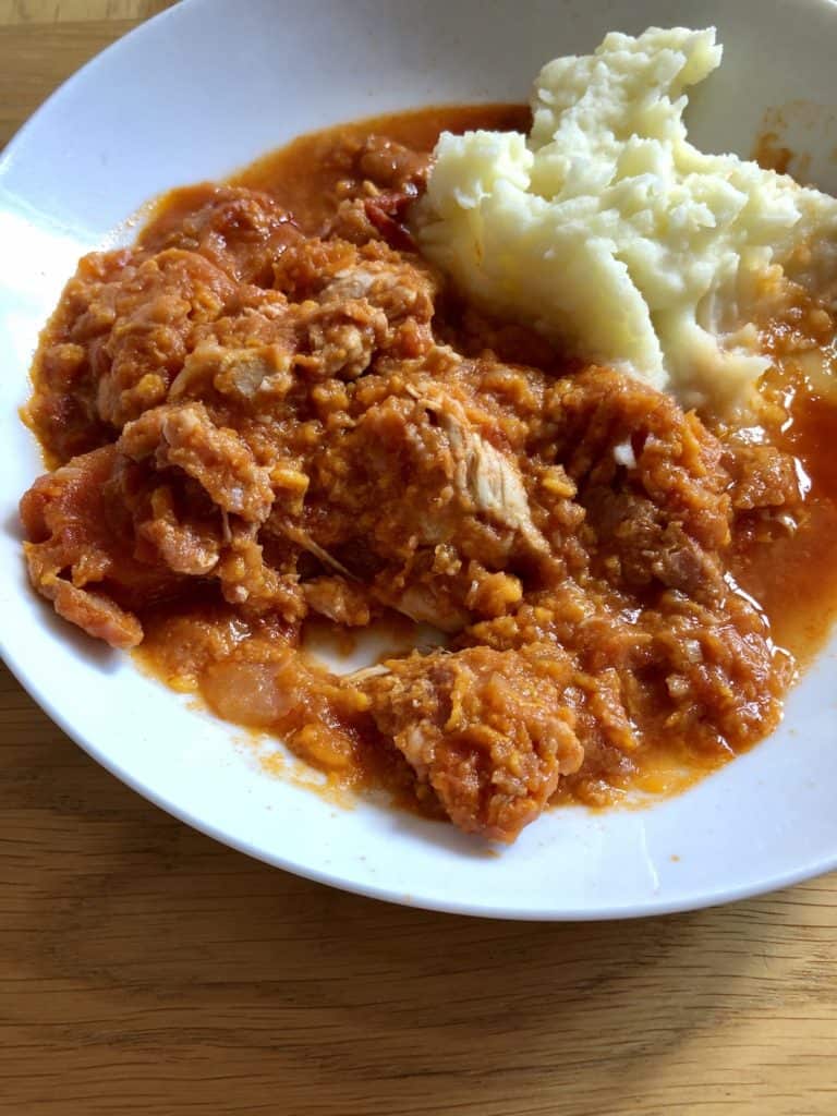 Photo of the Instant Pot Turkey Stew Recipe by Feisty Tapas served with mash, seen on a white plate