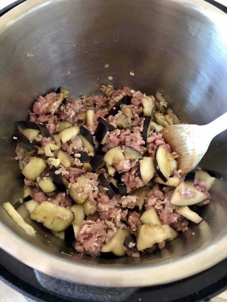 Image from above showing the browned mince mixed with the aubergine