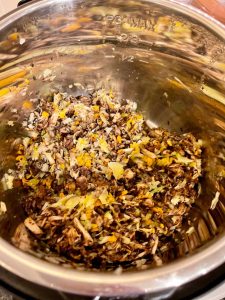 Instant Pot Mushroom Bolognese in stainless steel inner pot mushrooms and vegetables all chopped up