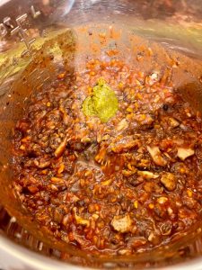 Photo of the ingredients for Instant Pot Mushroom Bolognese mixed in the inner pot and ready to pressure cook