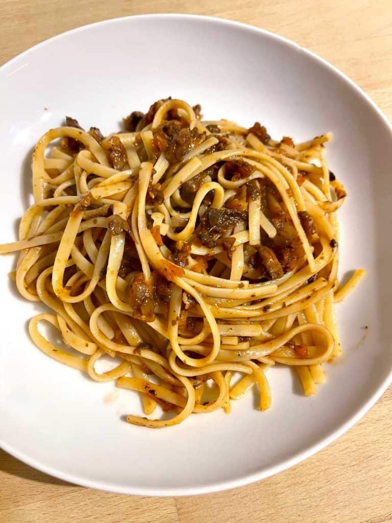 Instant Pot Mushroom Bolognese recipe served on deep white plate with linguine pasta