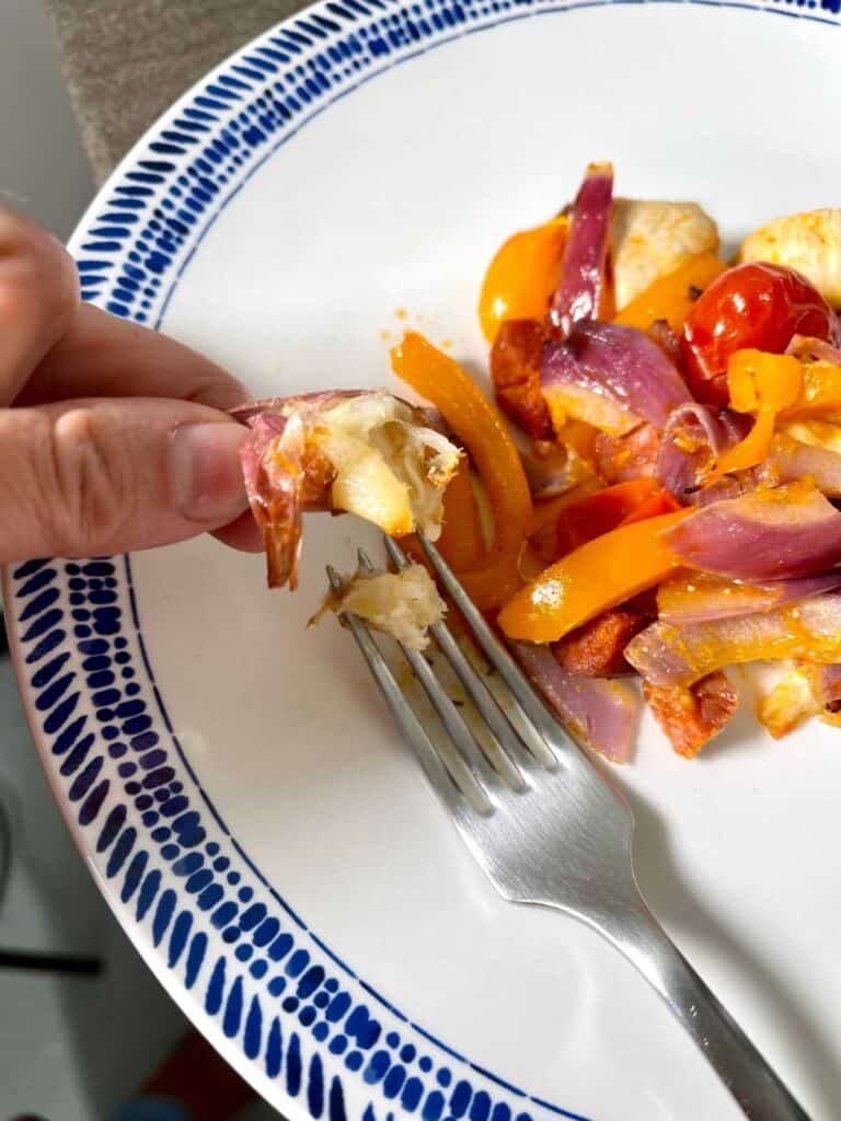 Squeezing a pressure cooked whole unpeeled clove of garlic