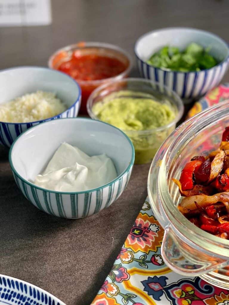 Toppings: soured cream, guacamole, coriander cilantro, salsa and grated cheese