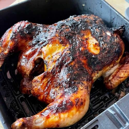 Glazed whole chicken looking lovely seen from above inside the black drawer of the Instant Vortex 4 in 1 5.7 litre / 6 quart