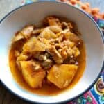 Photo of the chicken and butternut squash served in a bowl, seen close up from above