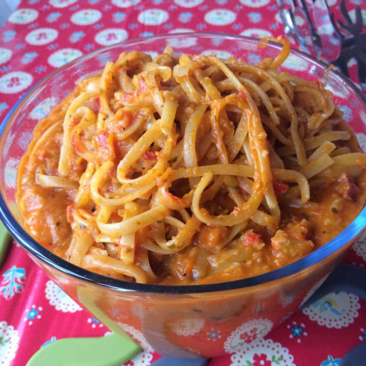 Photo of the cooked Thermomix Creamy Chorizo Pasta seen served in a large see-through Pyrex bowl, made with linguine
