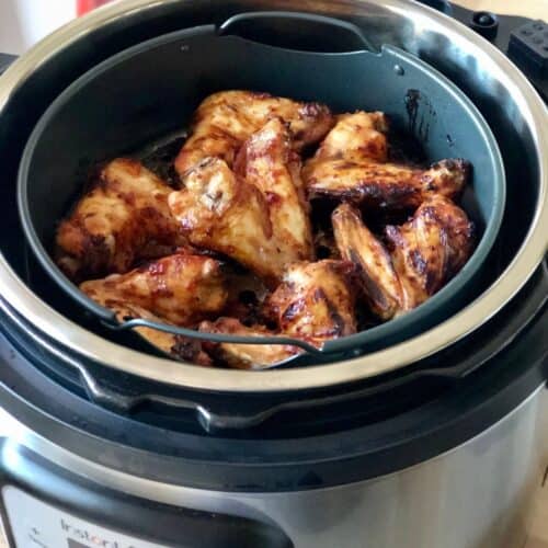 Air fried chicken wings seen from above inside the air fryer basket of the Instant Pot Duo Crisp