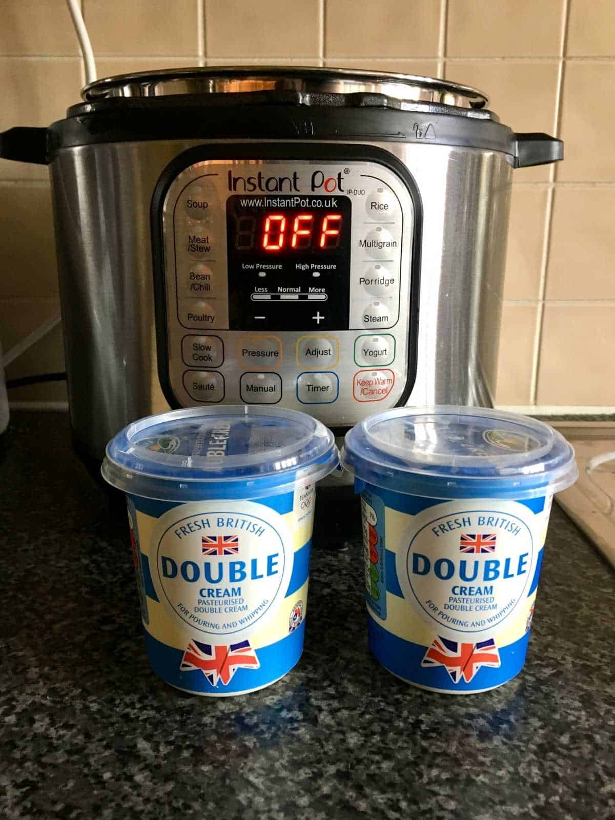 Photo of two pots of Double Cream from Tesco in front of an Instant Pot Duo