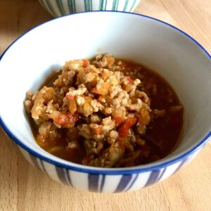 Instant Pot Thai Pork larb served inside a blue and white stripy bowl