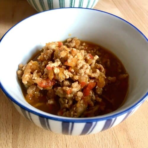 Instant Pot Thai Pork larb served inside a blue and white stripy bowl
