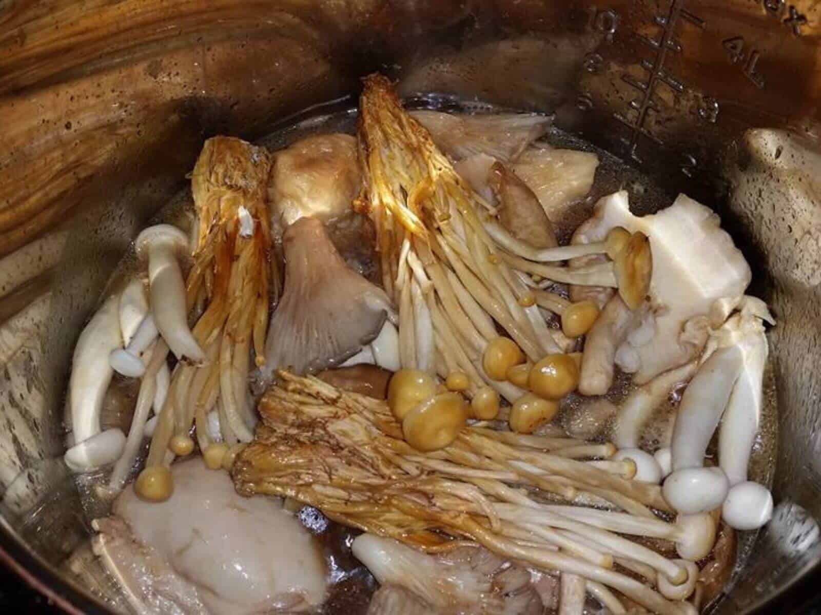 Photo of the raw chicken and the mushrooms ready to be pressure cooked