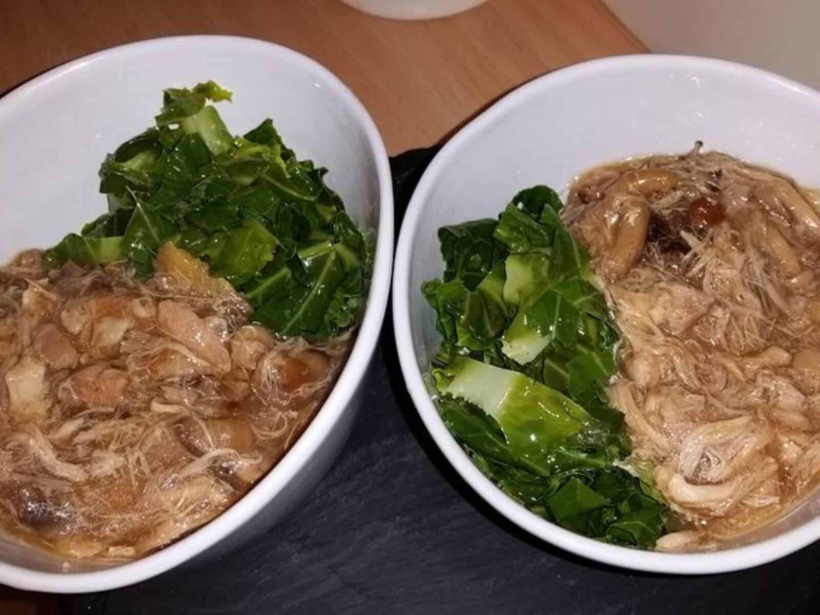 Photo of the Chinese Chicken and Mushroom served in two bowls with green vegetables