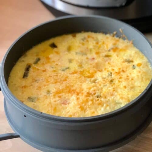The delicious Instant Pot Duo Crisp Quiche just cooked and still inside the cake pan