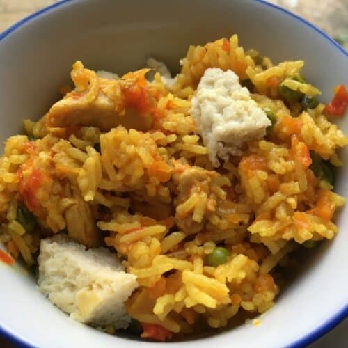 The fried rice Instant Pot Nasi Goreng (Malaysian Fried Rice) served in a white bowl in blue rim