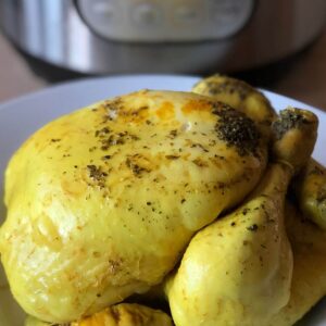 A delicious pressure cooked Zero Minute Chicken with an Instant Pot Duo in the background