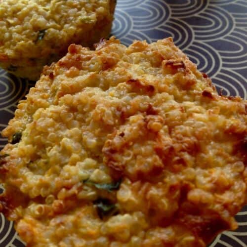 Two quinoa muffins ready to eat served on a tray with a seventies grey and white pattern