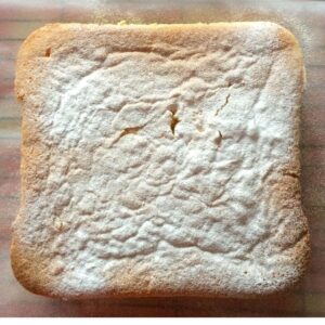 The Japanese cotton cheesecake in the shape of a square coated in powder sugar