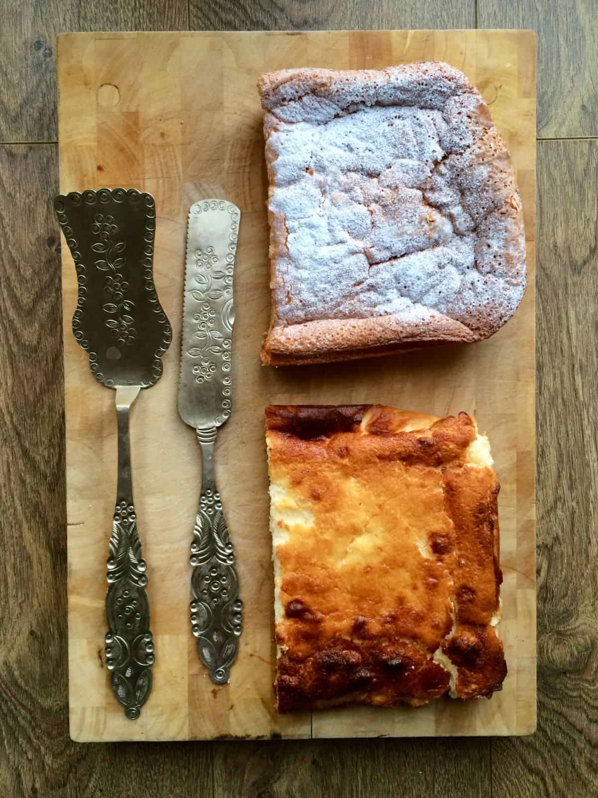 The Japanese Cotton Cheesecake and a Lemon Quark Cake on a wooden board with 2 ornate silver cake slices